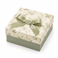 Boîte cadeau 25 x 25 x 10 cm en carton vert ivoire à motif floral avec ruban décoratif