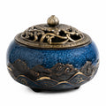 Brûle-encens rond 16 cm en céramique bleu bronze ajouré décoratif